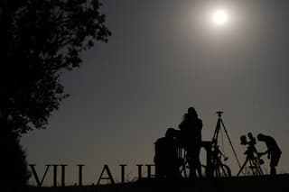 Researchers from San Francisco's Exploratorium museum carry out preparations for the global live broadcast of the upcoming August 12 total solar eclipse, in the abandoned village of Villalibado, near Burgos, northern Spain, on August 10, 2026. Around thirty scientists from the Exploratorium museum NASA's official partner for live astronomical coverage have set up three powerful telescopes in Villalibado to broadcast the eclipse live to 10 million people, choosing the village for its clear horizon, strong communications infrastructure, and location within the path of totality. (Photo by Cesar MANSO / AFP)