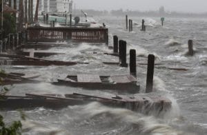 COCOA BEACH, FL - OCTOBER 07: Heavy waves caused by Hurricane Matthew pound the boat docks at the Sunset Bar and Grill, October 7, 2016 on Cocoa Beach, Florida. Hurricane Matthew passed by offshore as a catagory 3 hurricane bringing heavy winds and minor flooding. Mark Wilson/Getty Images/AFP