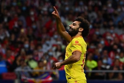 Liverpool's Egyptian forward Mohamed Salah celebrates after scoring his team's third goal during the UEFA Champions League Group B football match between Atletico Madrid and Liverpool at the Wanda Metropolitano stadium in Madrid on October 19, 2021. (Photo by GABRIEL BOUYS / AFP)