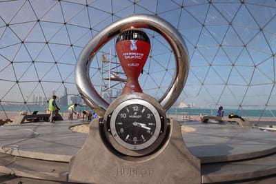 This picture shows the countdown clock along the Doha Corniche, on February 3, 2022, as Qatar prepares to host the FIFA World Cup 2022. (Photo by KARIM JAAFAR / AFP)