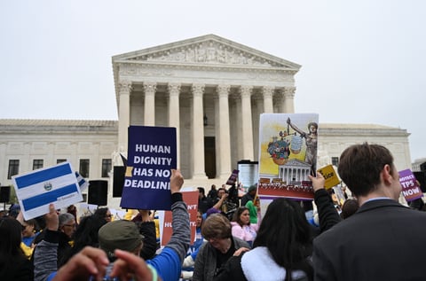 Members of the National TPS Alliance rally at the US Supreme Court in Washington, DC, on April 29, 2026. The Supreme Court is examining the revocation of Temporary Protected Status (TPS) for Haitian and Syrian migrants. (Photo by Alex WROBLEWSKI / AFP)
