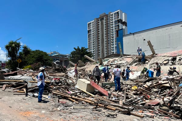 Rescuers look for survivors at a collapsed building after an earthquake in Pereira, Colombia on August 10, 2026. A powerful earthquake rocked Colombia and neighboring Latin American countries on August 10, 2026, with medical teams rushing to help victims after buildings were damaged or collapsed in several cities. The Colombian geological service and its American counterpart USGS put the magnitude at 7.4, with an epicenter 100 km (60 miles) underground in the west of the country. Colombia had initially put it at 6.6. (Photo by Roberto Betancourt / AFP)